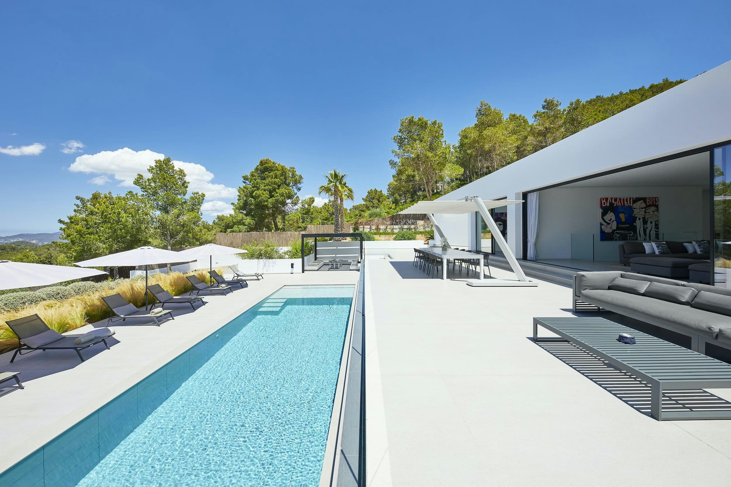 Dancing Shadows villa aerial view with infinity pool and terraces, Sant Josep de sa Talaia, Spain